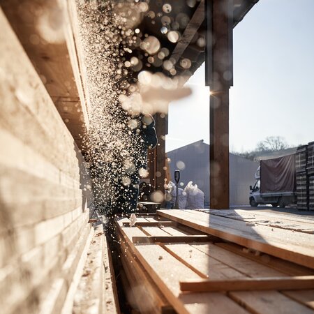 The image shows a cinematic shot from the RUKU1952 carpentry workshop in Romania.