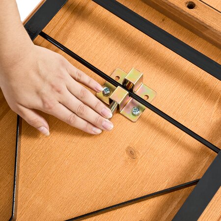 Folding mechanism detail he folding mechanism of a beer garden table set is being opened.