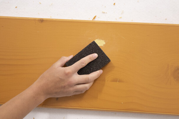 Sand the affected area smooth with sandpaper.