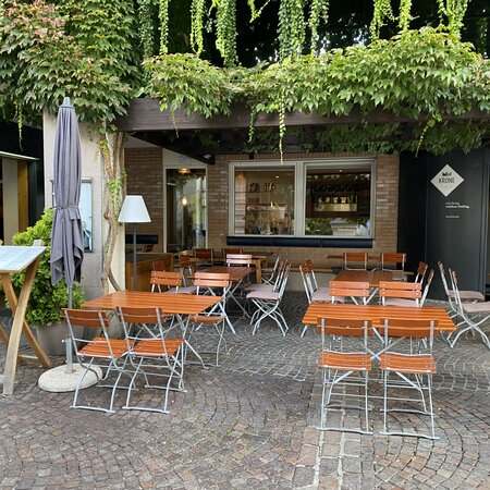 Square beer garden furniture is set up on the terrace of Hotel Krone.