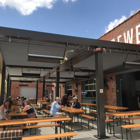 In the outdoor area of Wooden Robot Brewery, numerous beer tent sets in pine have been arranged.